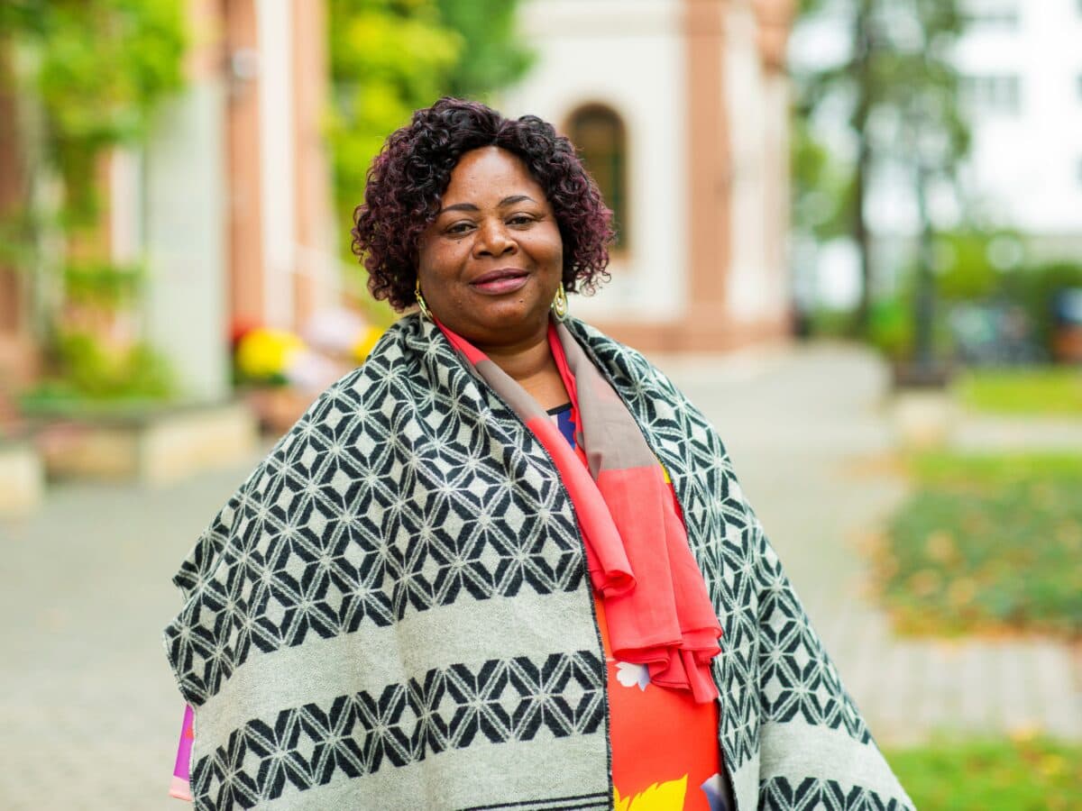 rebecca mfutila in the garden of the mission house in basel