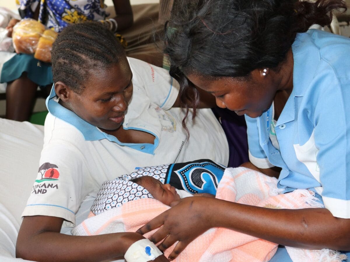 A midwife cares for a young mother